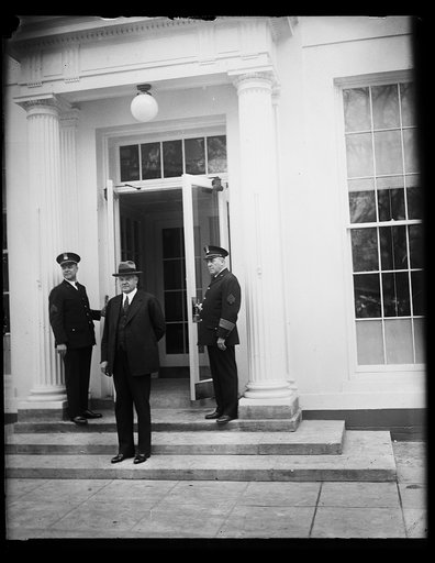 Pres. Hoover going into executive offices after remodeling