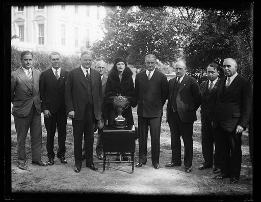 Herbert Hoover and group and cup outside White House, Washington, D.C.