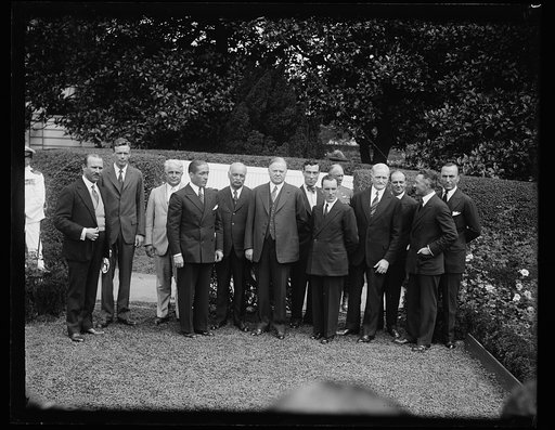 Group, left to right: unidentified, Charles Lindbergh, James J. Davis, unidentified, Charles Curtis, Herbert Hoover; John Pershing, 4th from right