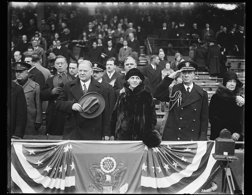 Herbert Hoover and Lou Hoover in stands