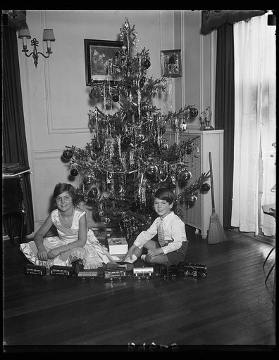Elizabeth and J. Hamilton Fish, 3rd, children of Rep. and Mrs. J. Hamilton Fish of New York, and their attractive Christmas tree