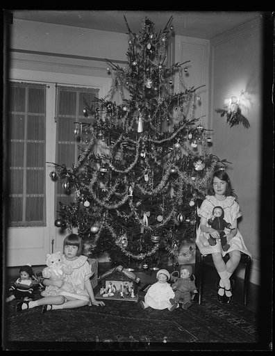 Elinor and Gloria, daughters of Capt. and Mrs. Emmett Gudger and granddaughters of Sen. Walsh of Montana, and their Christmas tree