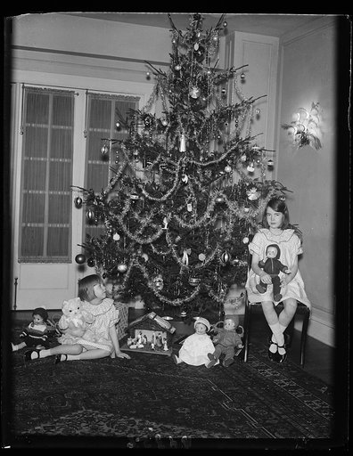 Elinor and Gloria, daughters of Capt. and Mrs. Emmett Gudger and granddaughters of Sen. Walsh of Montana, and their Christmas tree