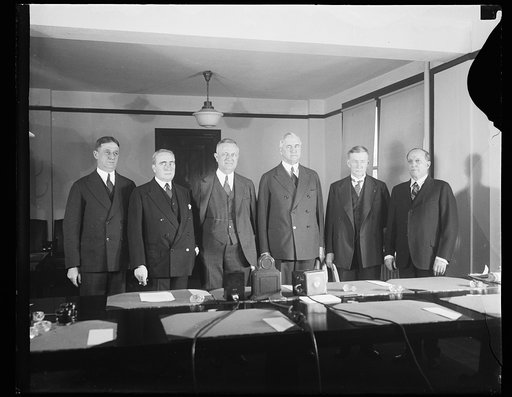 Ogden Mills, 2nd from left, Jesse H. Jones, 3rd from right, and Charles G. Dawes, 2nd from right
