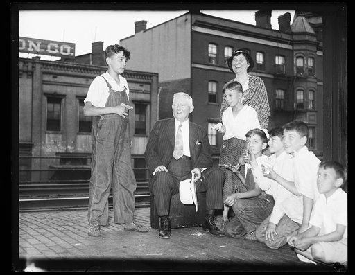 John Nance Garner on train platform with children