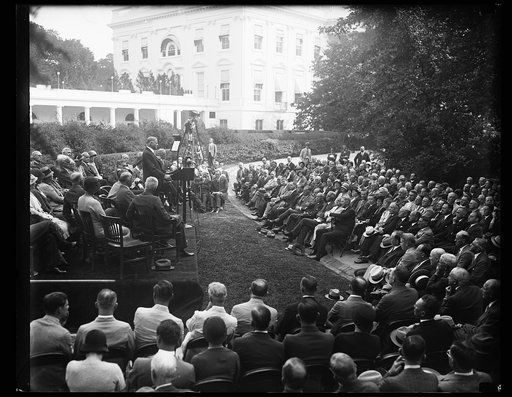 Herbert Hoover at podium addressing group outside White House, Washington, D.C.