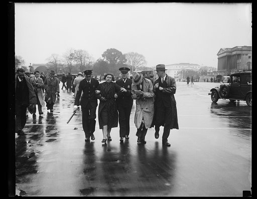 Police escorting woman outside U.S. Capitol, Washington, D.C.