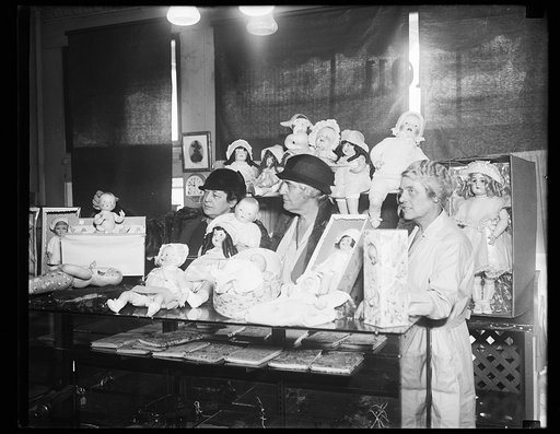 Women with doll display; Lou Hoover, center