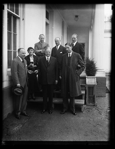 Herbert Hoover with group at White House; Ray Wilbur, right front
