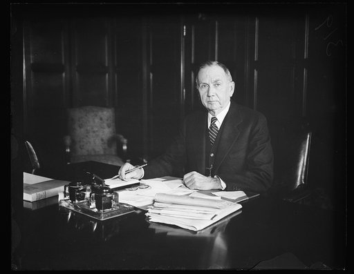 Daniel C. Roper at desk