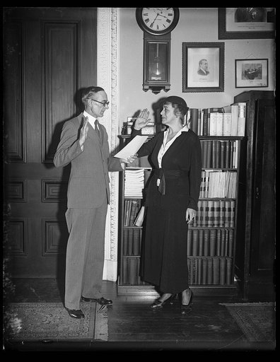 Ruth Bryan Owen being sworn in as Ambassador to Denmark by P. F. Allen, chief of the Appointment Section of the State Department, April 13, 1933