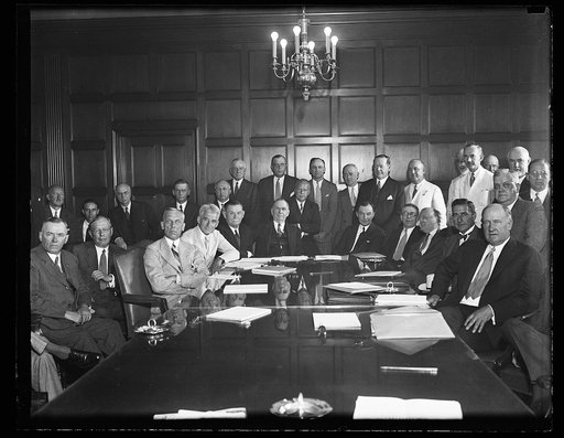 Group; includes Daniel C. Roper at head of table