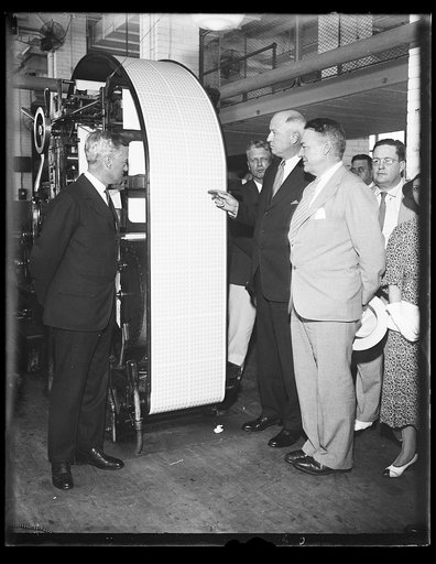 James A. Farley, center