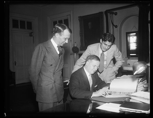 Harold L. Ickes? at desk