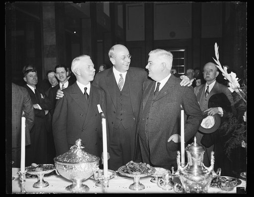 Homer S. Cummings, center