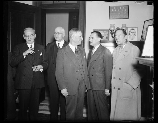 George Dern, center