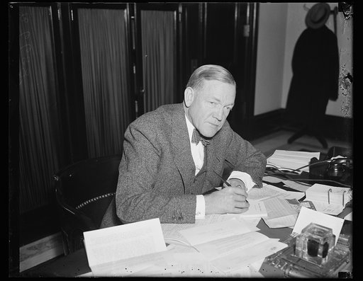 Charles L. McNary at desk
