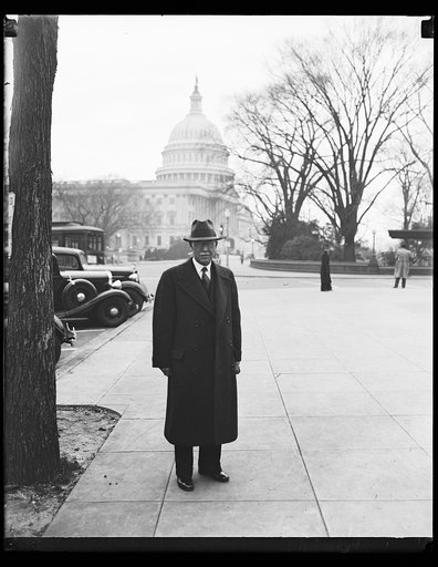 Man; U.S. Capitol in background. Washington, D.C.