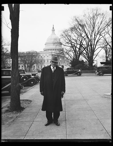 Man; U.S. Capitol in background. Washington, D.C.