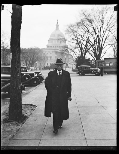 Man; U.S. Capitol in background. Washington, D.C.