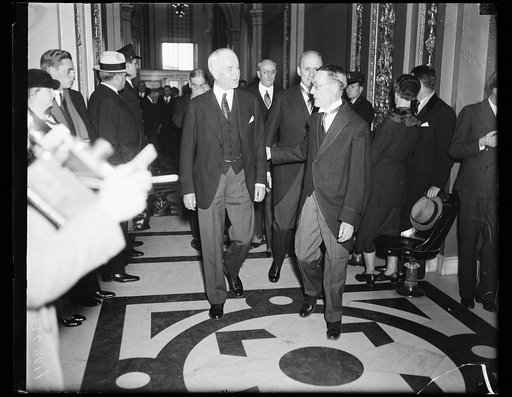 Cordell Hull, center