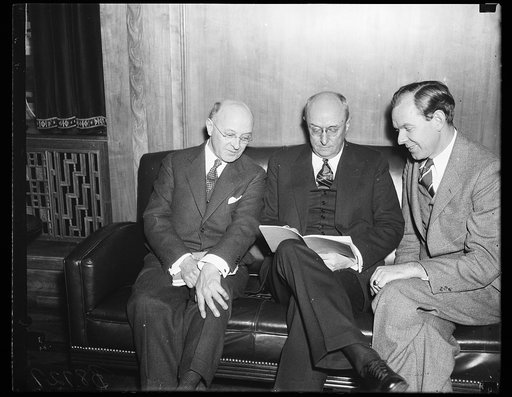Homer S. Cummings, center