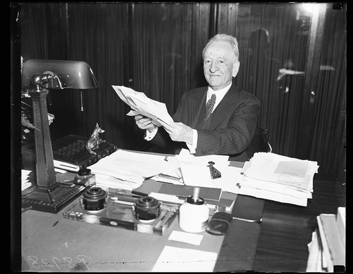 Carter Glass at desk