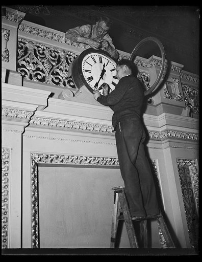 Man working on clock in U.S. Capitol, Washington, D.C.