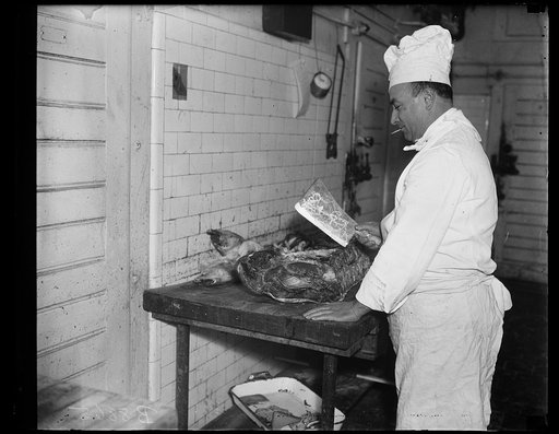 Cook with meat and meat cleaver