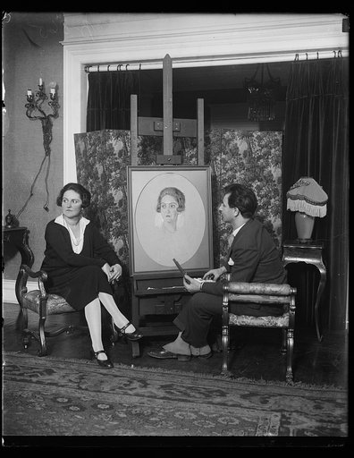 Artist working on portrait of woman