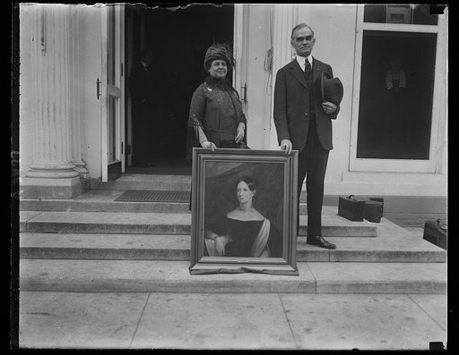 Unidentified woman and Joseph Byrns with portrait of woman; White House, Washington, D.C.