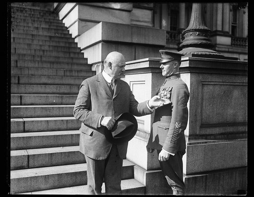John W. Weeks on steps of State, War, and Navy Building, Washington, D.C.
