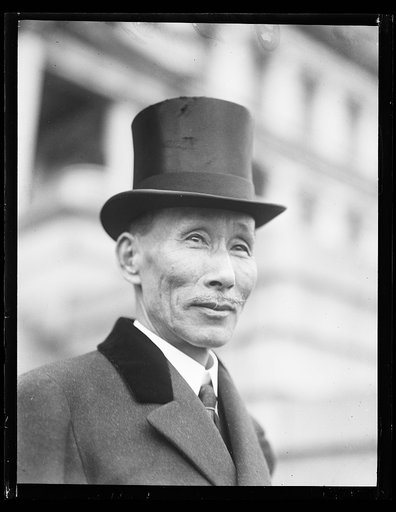 Man in front of State, War and Navy Building, Washington, D.C.