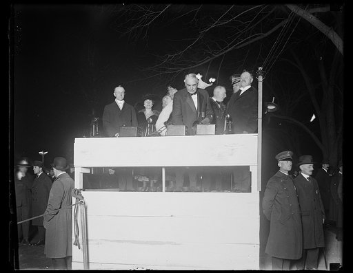 Outdoor stand with Calvin Coolidge, Grace Coolidge, Florence Harding and Warren Harding