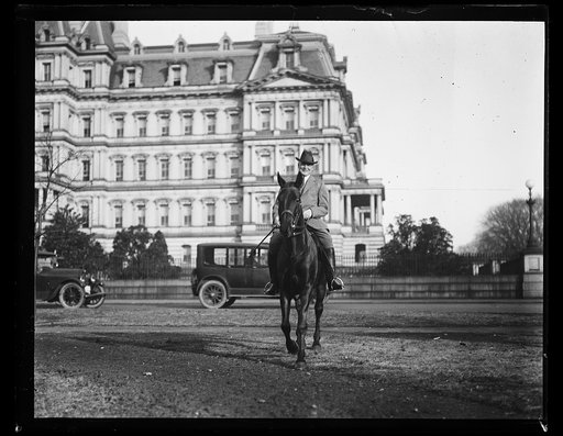 Warren Harding on horse; State, War and Navy Building in background. Washington, D.C.
