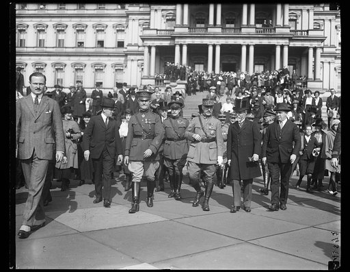 Foch, J.J. Jusserand and group. State, War & Navy Building in background. Washington, D.C.