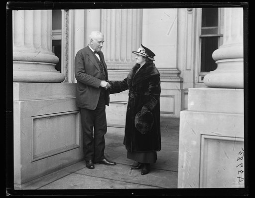 Man and woman shaking hands at U.S. Capitol, Washington, D.C.