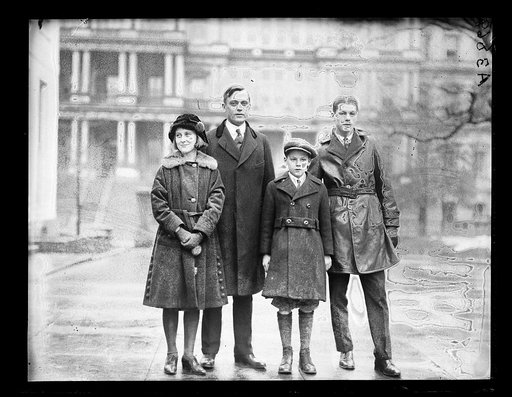 Henry C. Wallace and children; State, War and Navy Building in background. Washington, D.C.