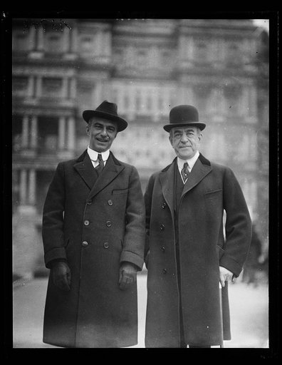 Men; State, War and Navy Building in background. Washington, D.C.