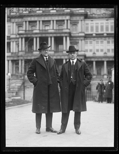 Men; State, War and Navy Building in background. Washington, D.C.