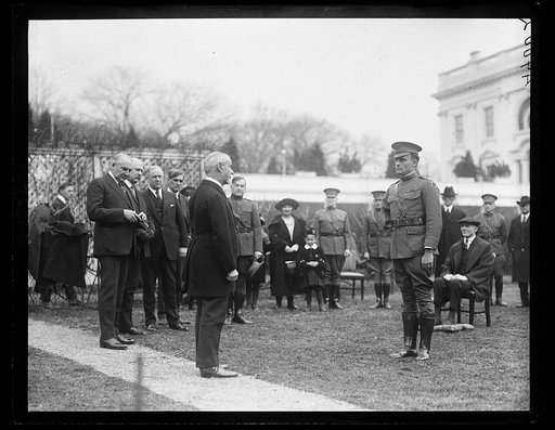Ceremony outside White House with wounded soldier; Warren Harding at left. Washington, D.C.