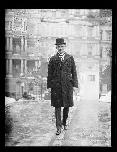 Man; State, War and Navy Building in background. Washington, D.C.