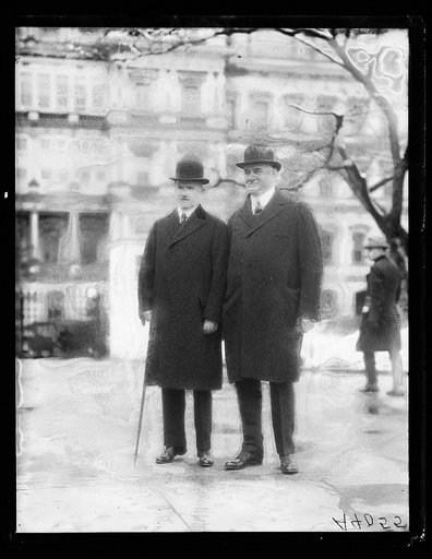 Men; State, War and Navy Building in background. Washington, D.C.