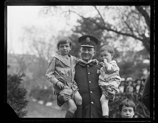 Police Officer holding children