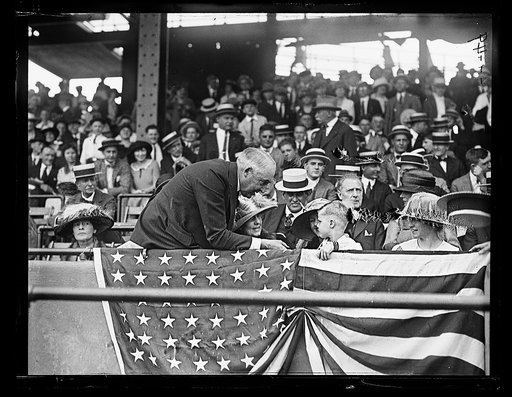 Warren Harding speaking to child in stands