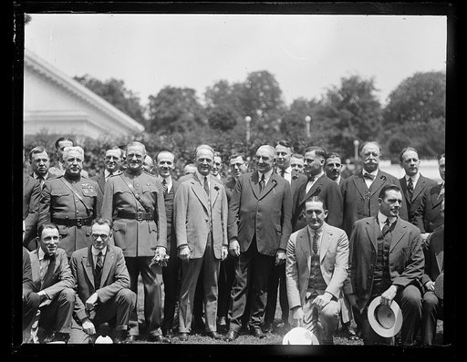 Group outside White House: includes John J. Pershing, right, Warren Harding, center, and William H. Taft, left