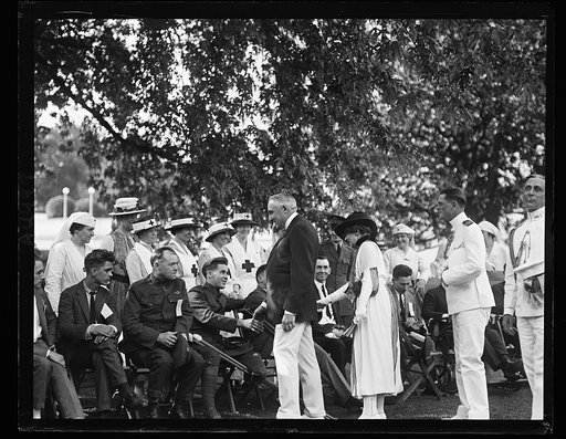 Pres. and Mrs. Harding shaking hands with wounded soldiers at the garden party [Washington, D.C.
