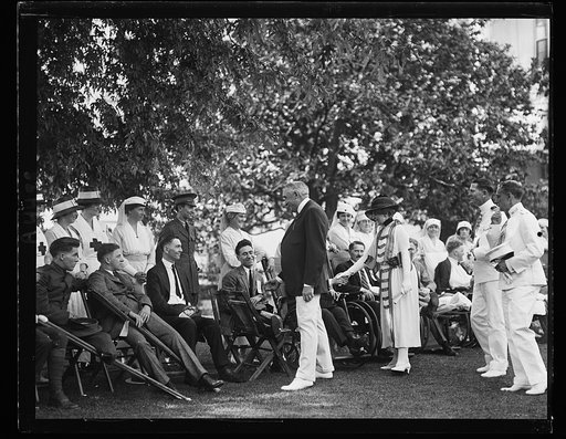 Pres. and Mrs. Harding shaking hands with wounded soldiers [Washington, D.C.