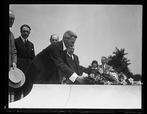 Man placing flowers on Tomb of the Unknown Soldier, Arlington National Cemetery, Arlington, Virginia