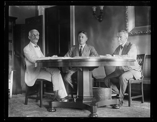 Group at table; Andrew W. Mellon, left, J.J. Jusserand, right